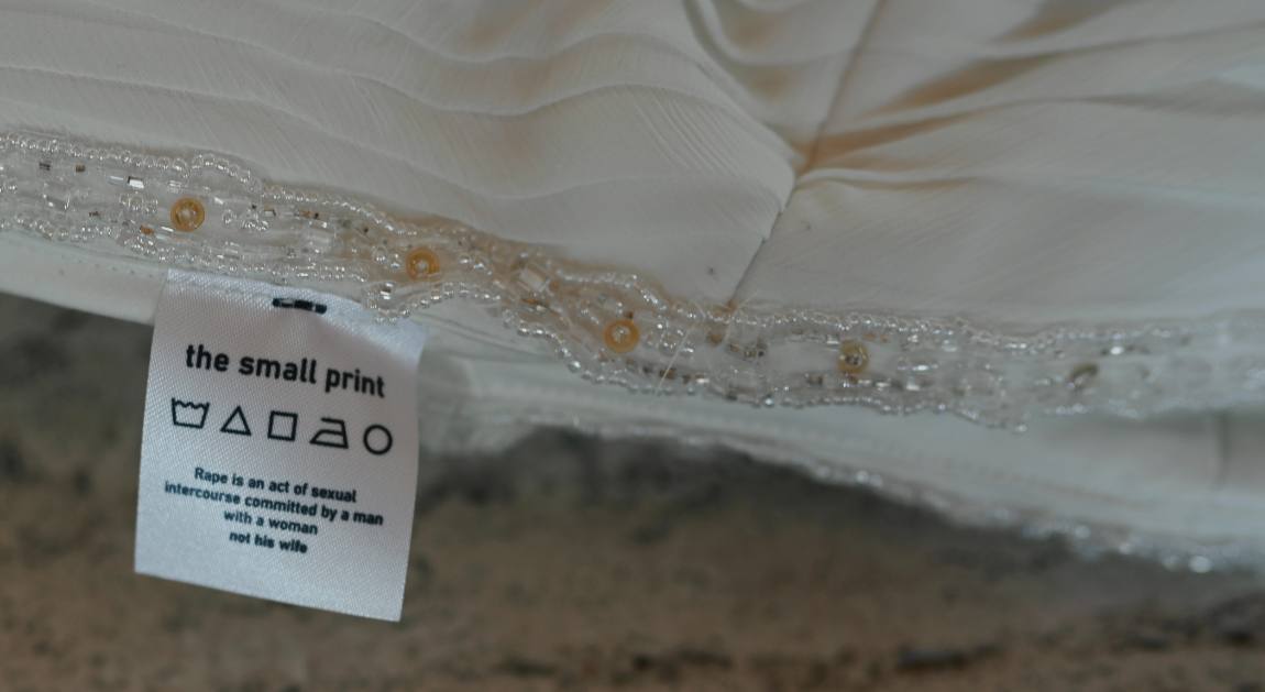 I'm fine: care label sewn into a beaded wedding dress hem